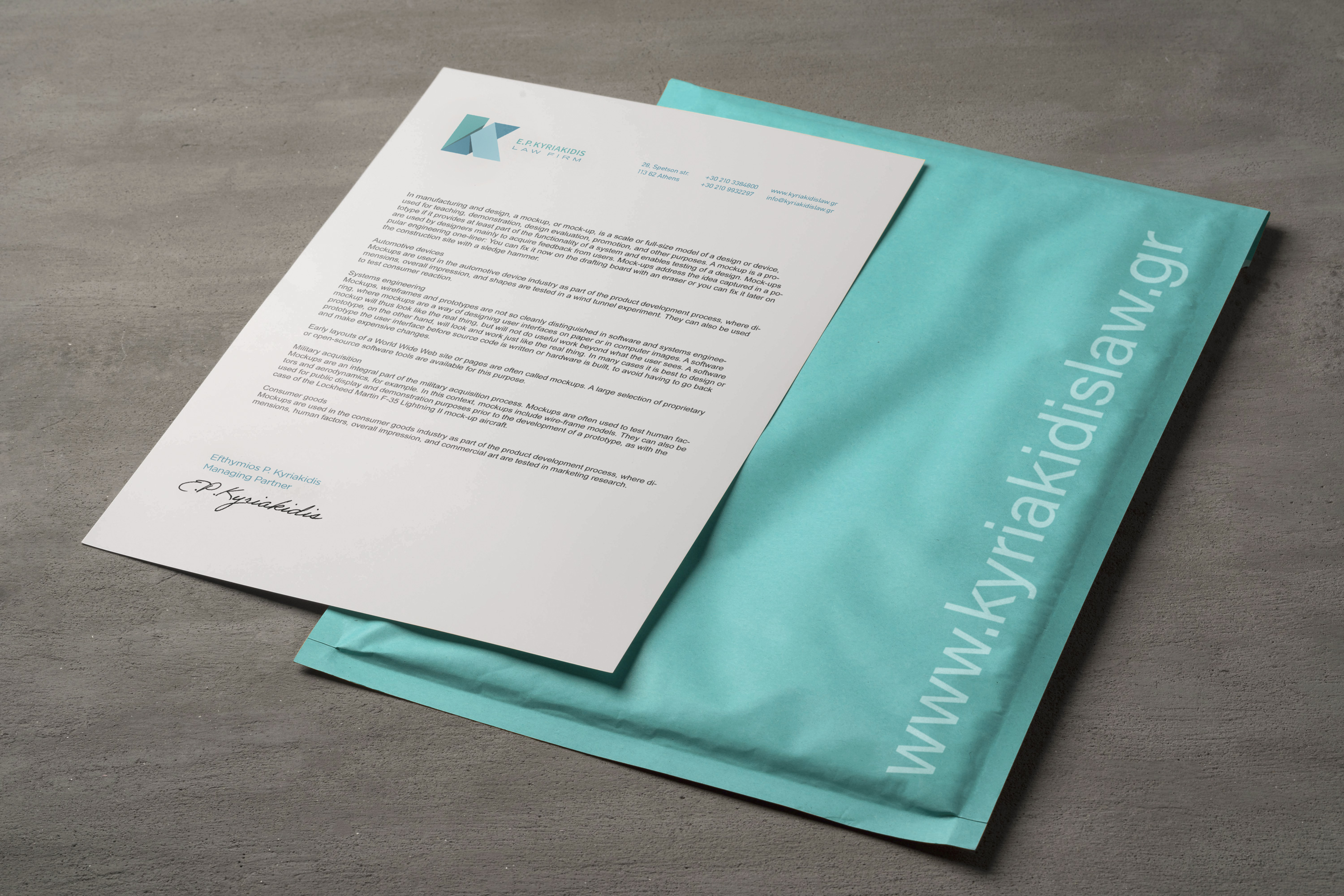 Kyriakidis Law Letterhead and bubble envelope.