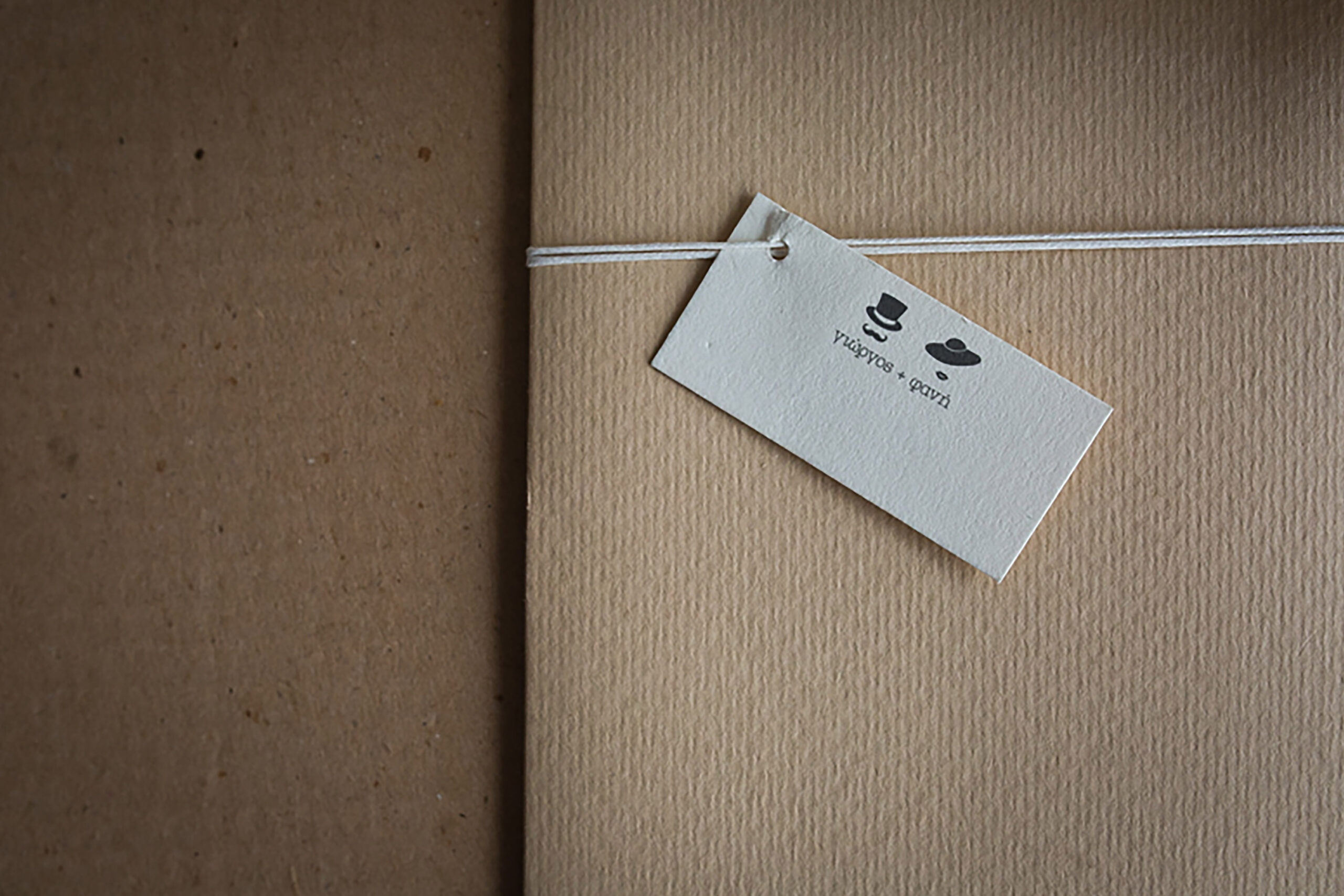 Wedding Letterpress typograhy invitation with custom craft envelope and paper tag hanger.