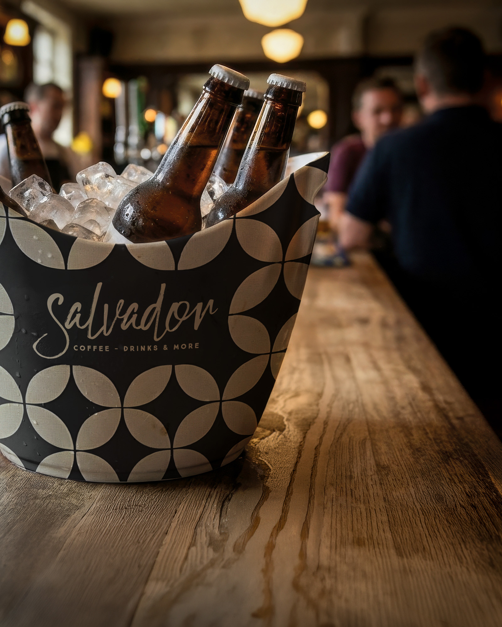 Salvador branded ice bucket full of ice and cold beers.