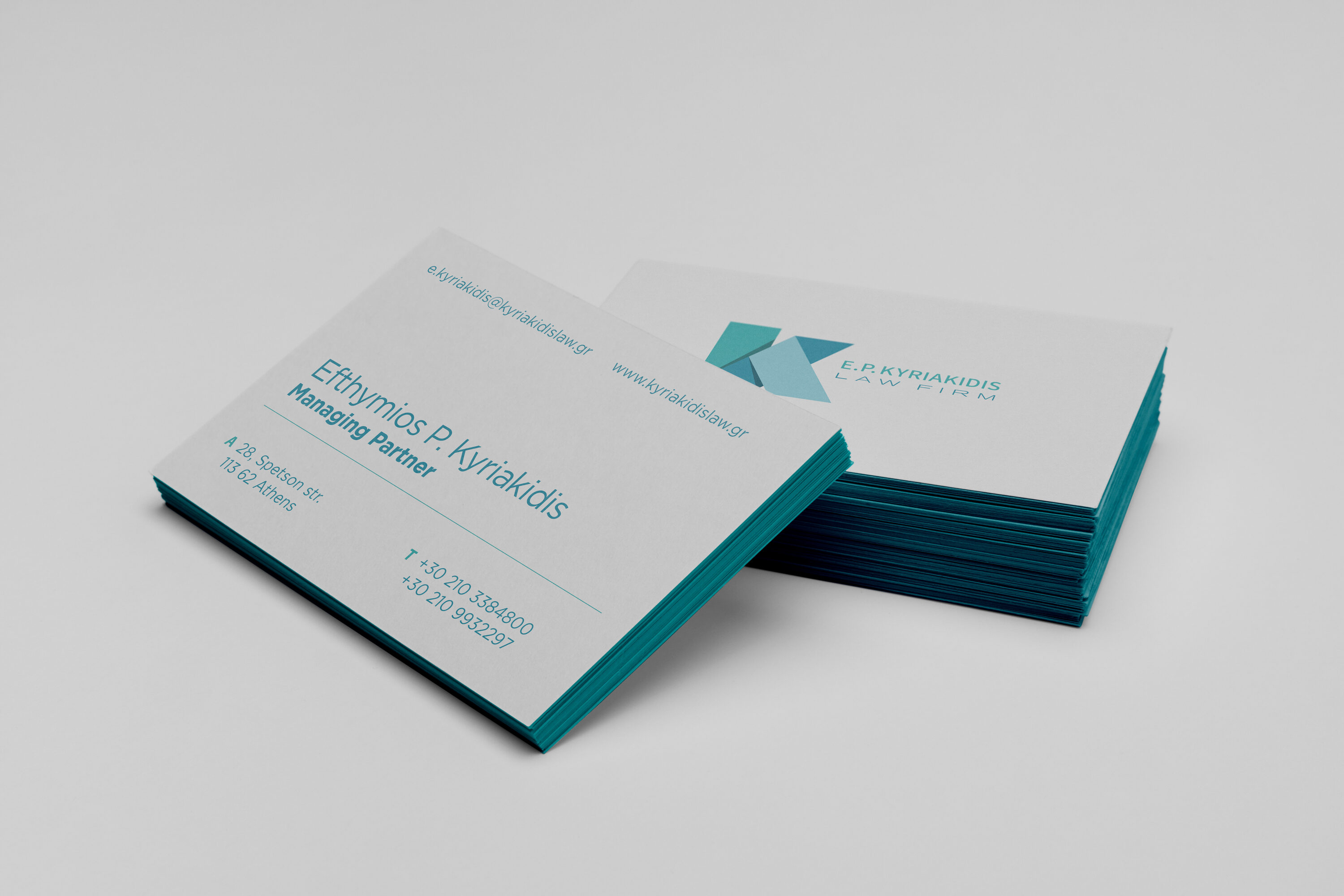 Kyriakidis Law business cards printed in thick laminated craft paper with letterpress.