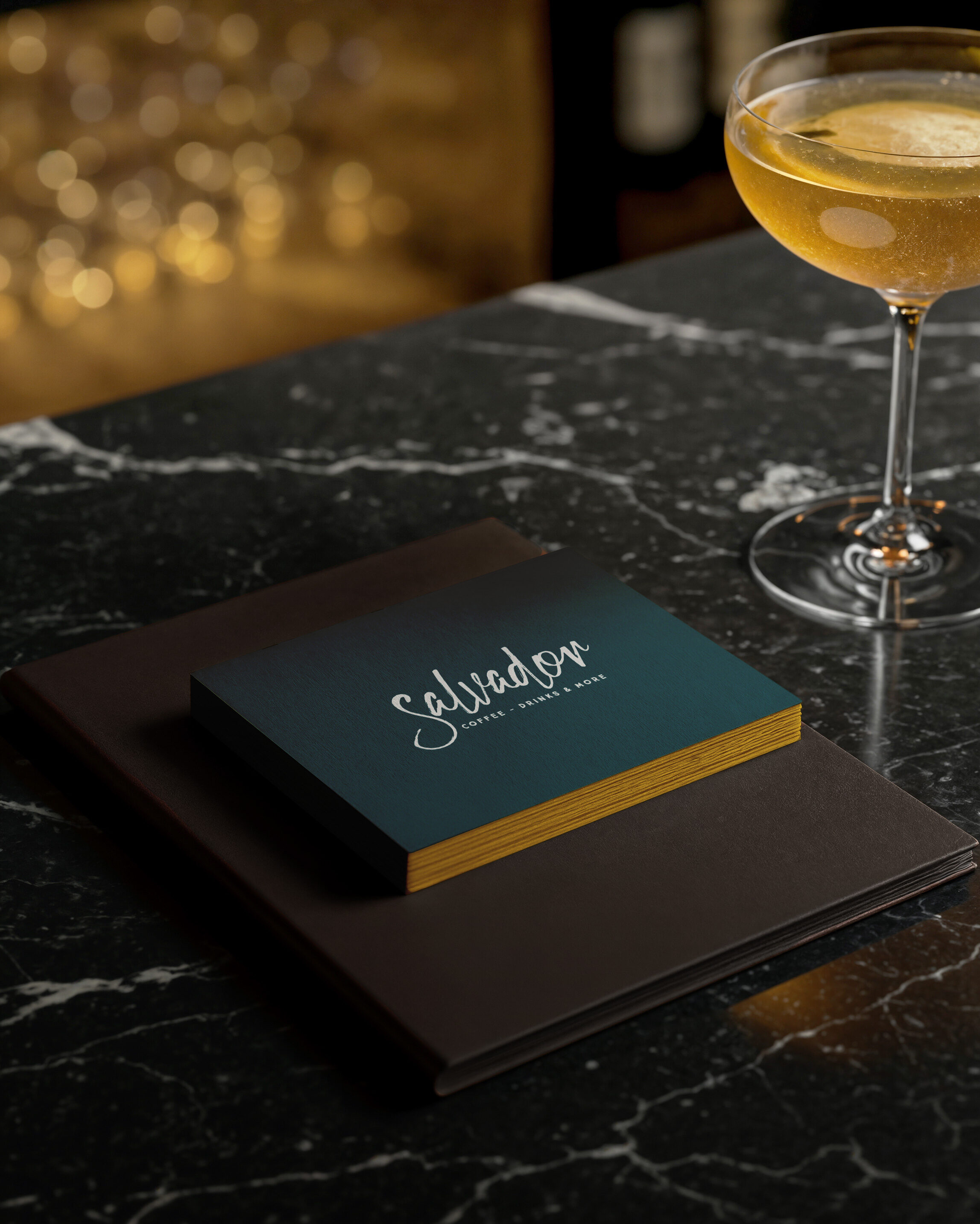 Stack of thick Salvador Bar Athens business cards on laminated 400gr papers with letterpress in front side.