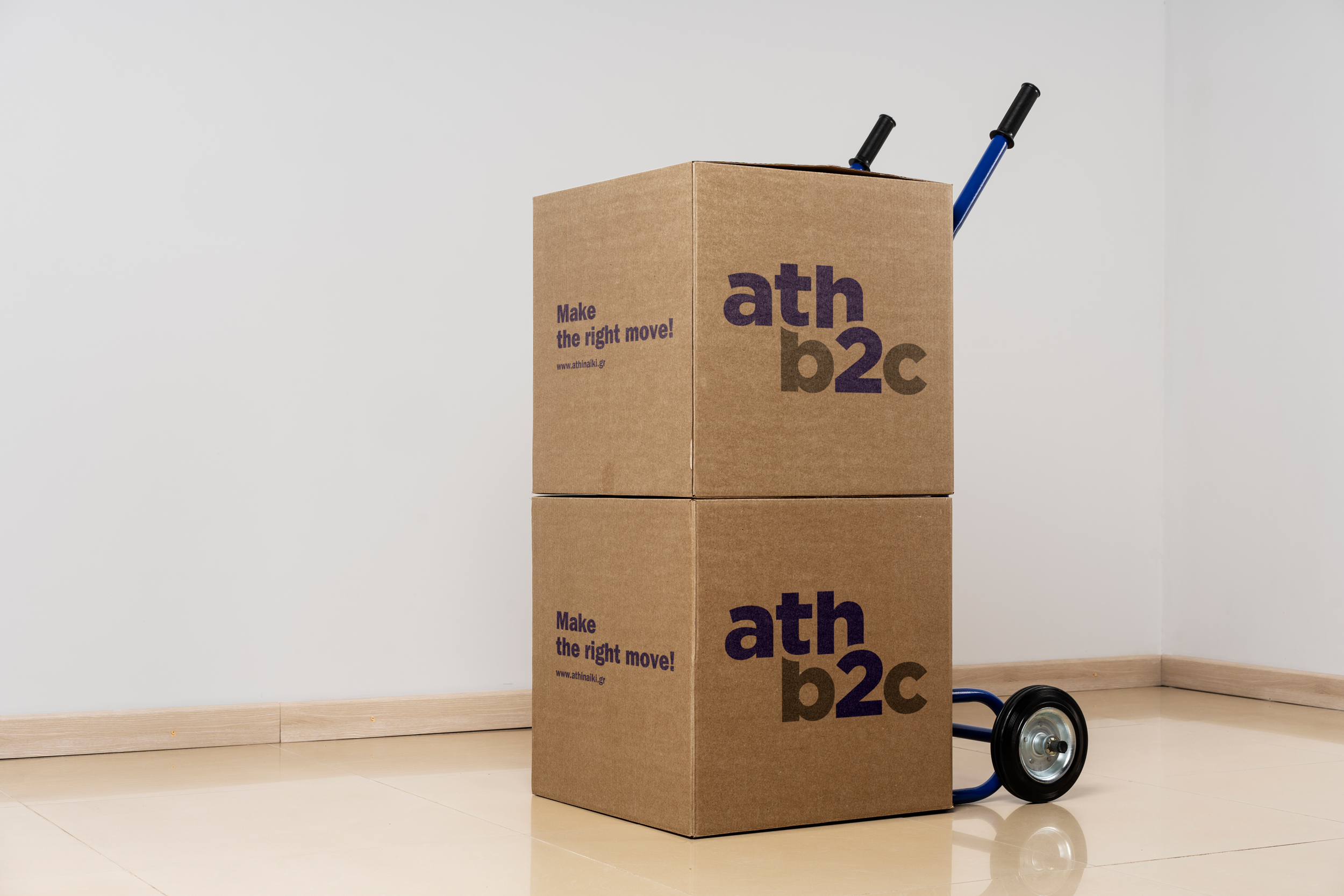 Athb2c branded moving boxes loaded on a hand truck