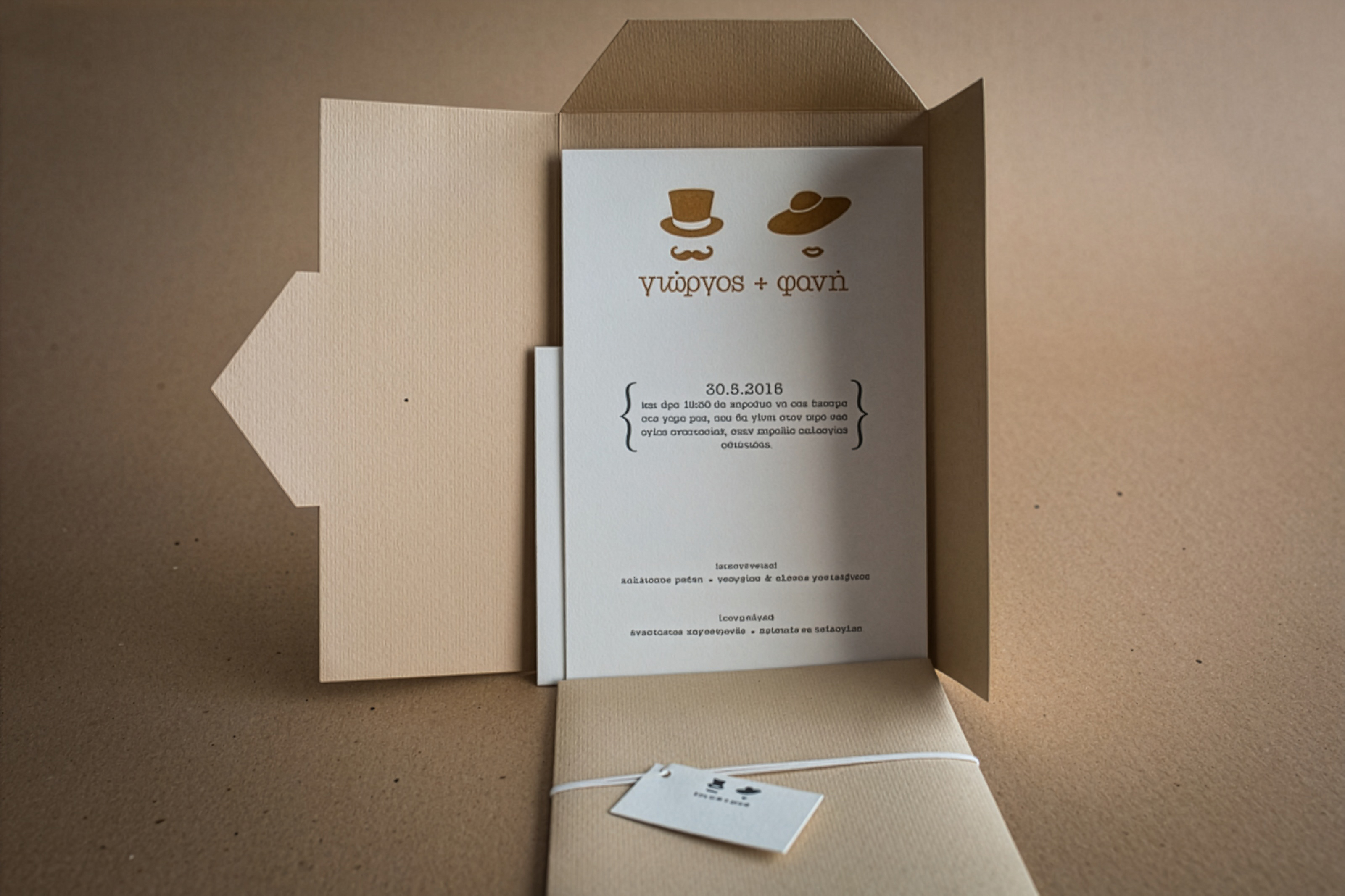 Letterpress wedding typography invitation with custom craft envelope.