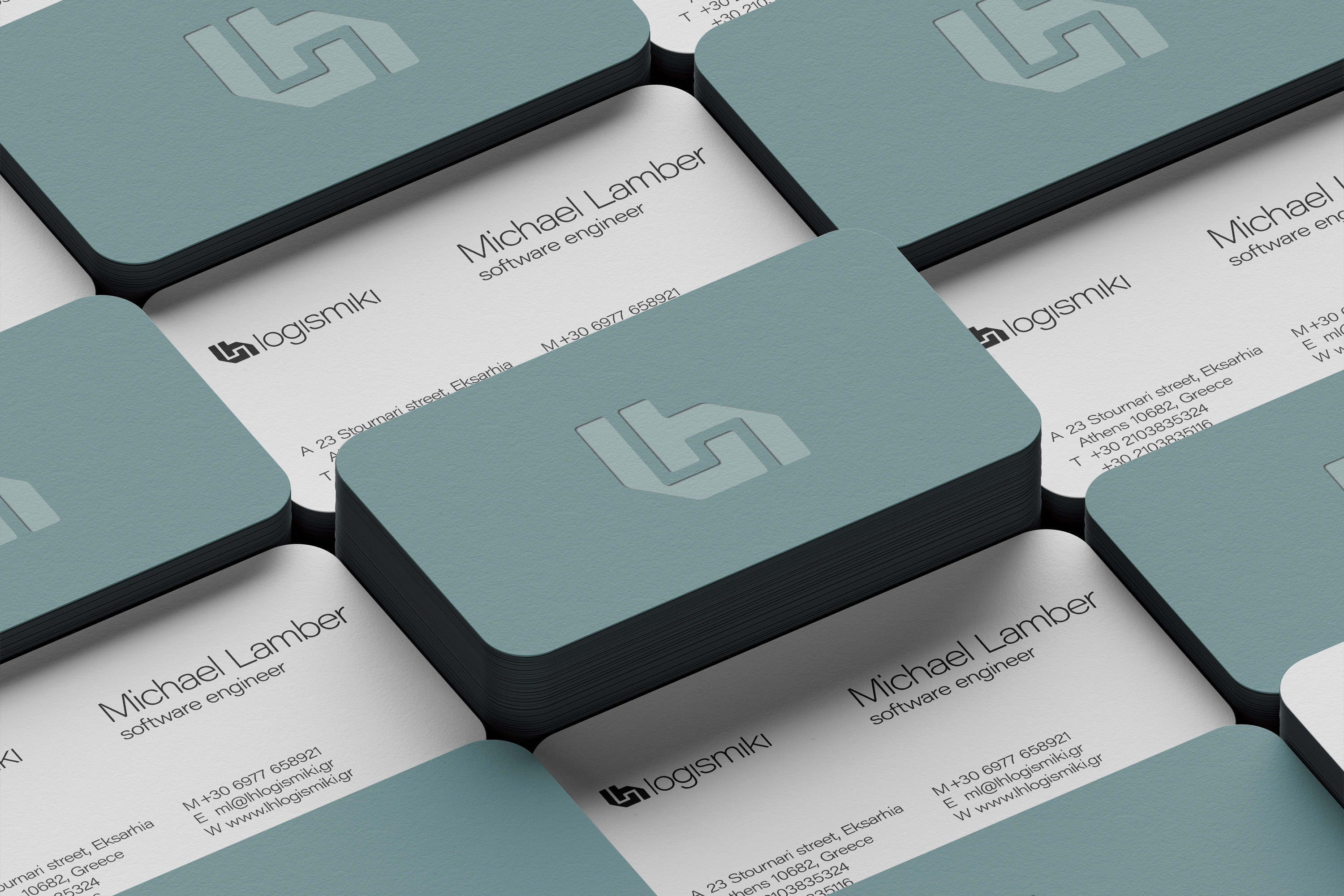 Stack of thick LH Logismiki Business Cards with letterpress on the front side.